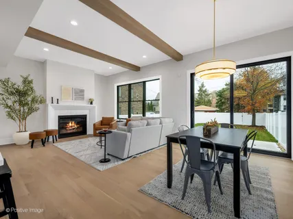 a living room with furniture a window and a fireplace
