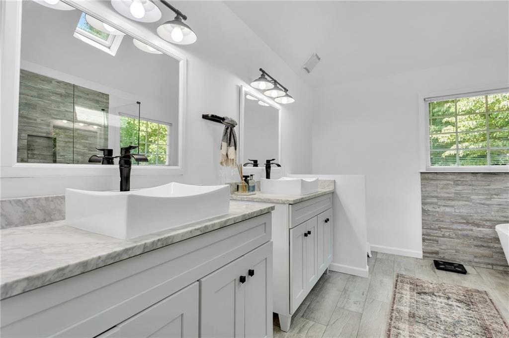 145 Springfield Creek Road Alpharetta, GA 30004 - Photo 18 of 27 a bathroom with double vanity and a mirror