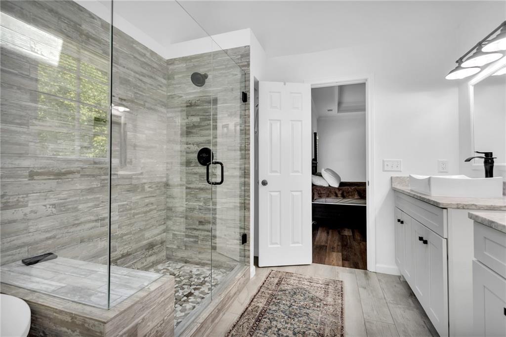 145 Springfield Creek Road Alpharetta, GA 30004 - Photo 19 of 27 a bathroom with a shower and a sink