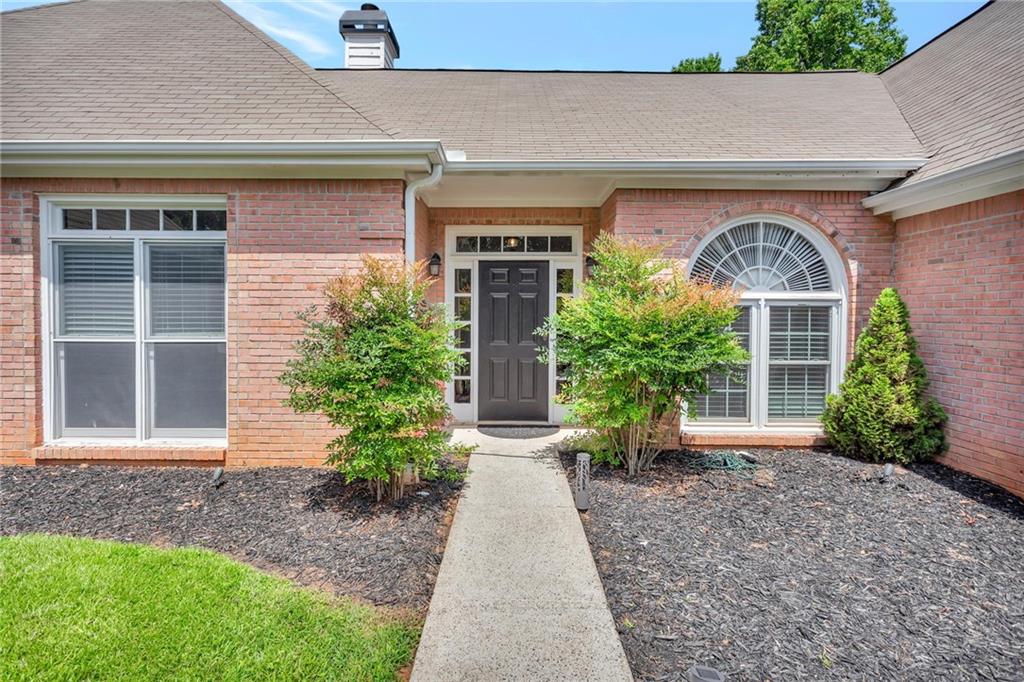 145 Springfield Creek Road Alpharetta, GA 30004 - Photo 2 of 27 front view of house with potted plants
