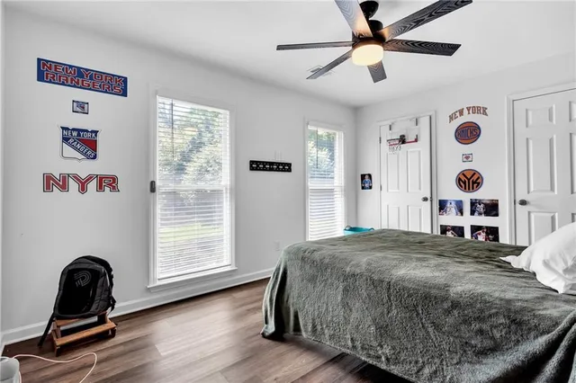 a bedroom with a bed and cabinet