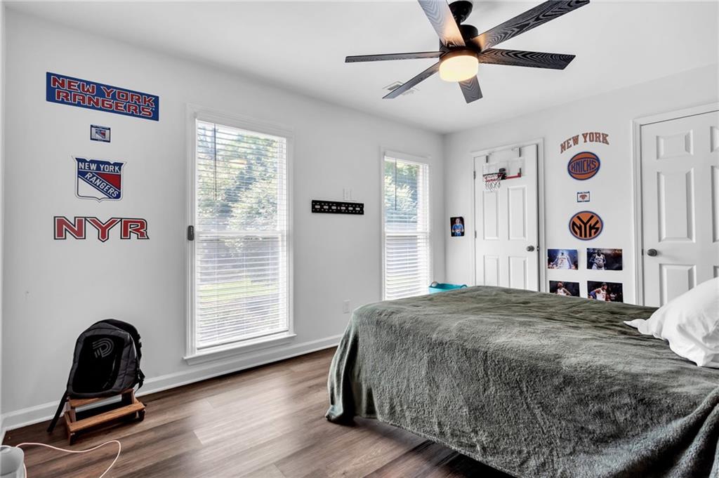 145 Springfield Creek Road Alpharetta, GA 30004 - Photo 21 of 27 a bedroom with a bed and a window