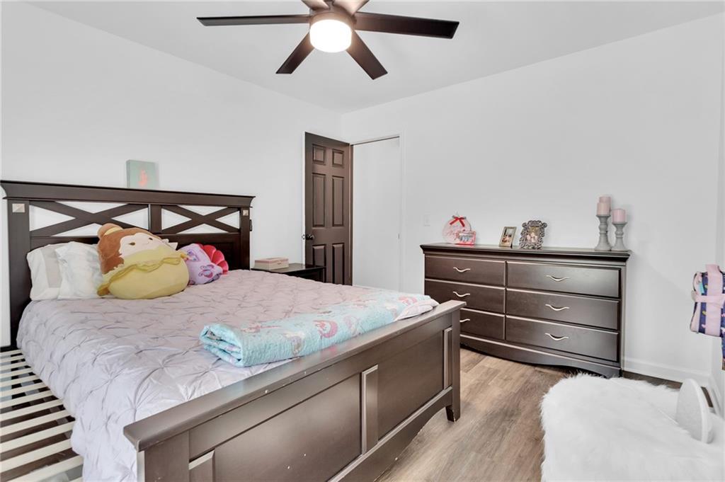 145 Springfield Creek Road Alpharetta, GA 30004 - Photo 22 of 27 a bedroom with a bed and cabinet