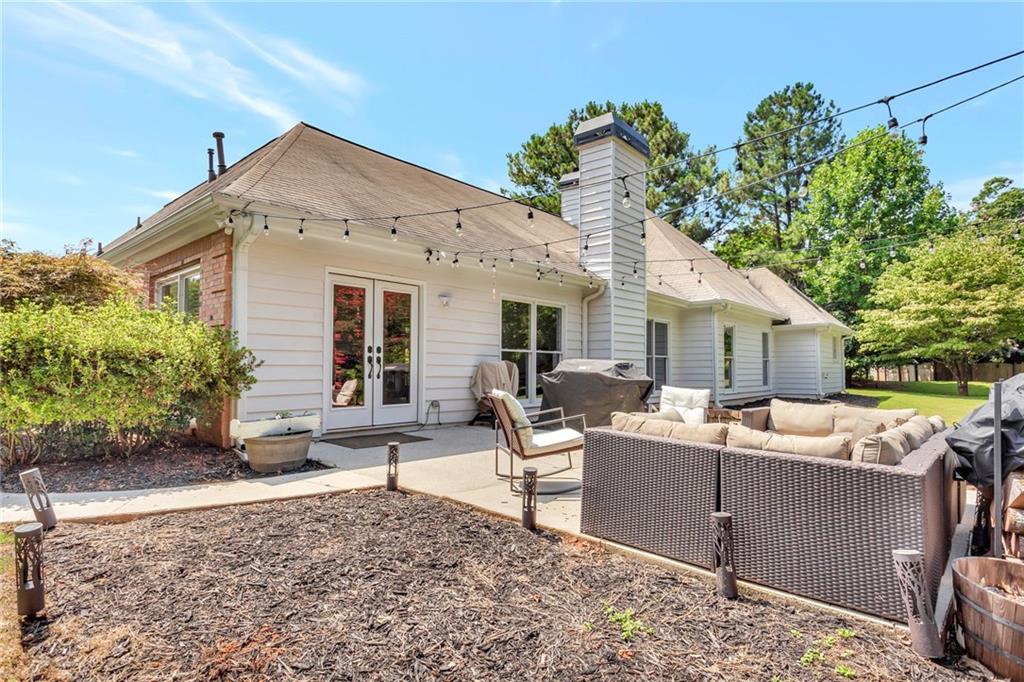145 Springfield Creek Road Alpharetta, GA 30004 - Photo 25 of 27 a view of a house with backyard and sitting area