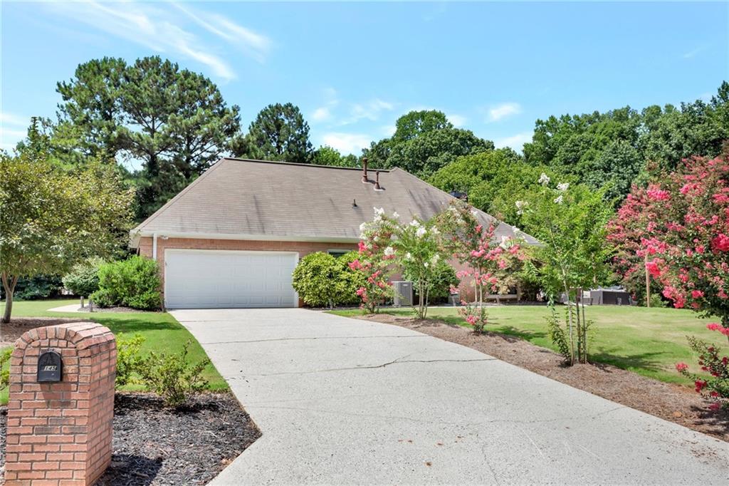 145 Springfield Creek Road Alpharetta, GA 30004 - Photo 27 of 27 front view of a house with a yard