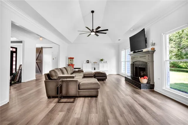 a kitchen with appliances a sink cabinets and wooden floor