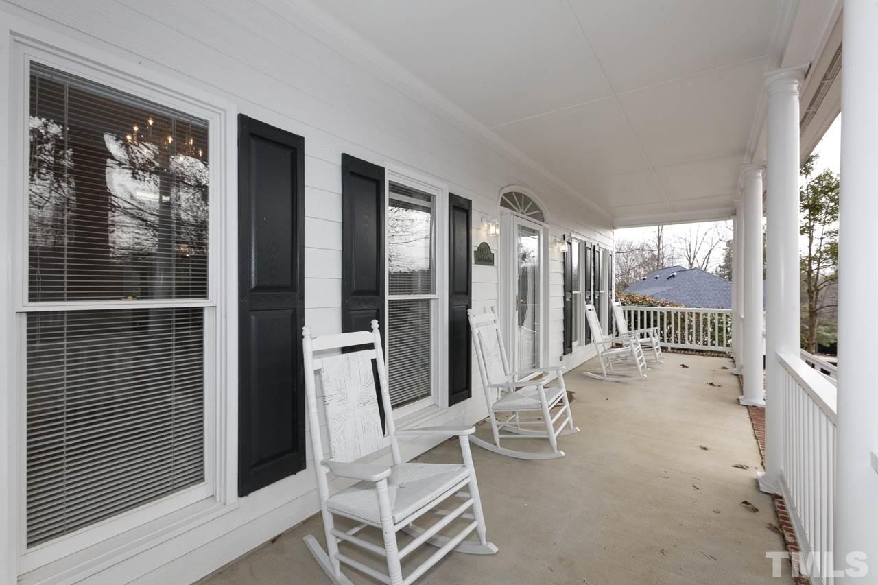 1432 Turner Farms Road Garner, NC 27529 - Photo 2 of 25 a living room with hardwood floor and large windows