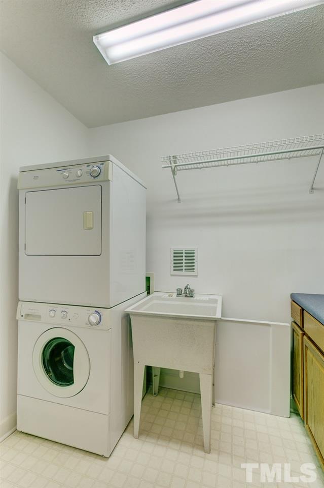 1432 Turner Farms Road Garner, NC 27529 - Photo 13 of 25 a utility room with dryer and washer