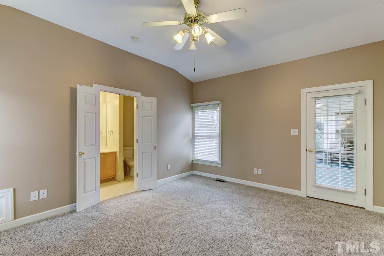1432 Turner Farms Road Garner, NC 27529 - Photo 14 of 25 a view of an empty room with chandelier fan and a window
