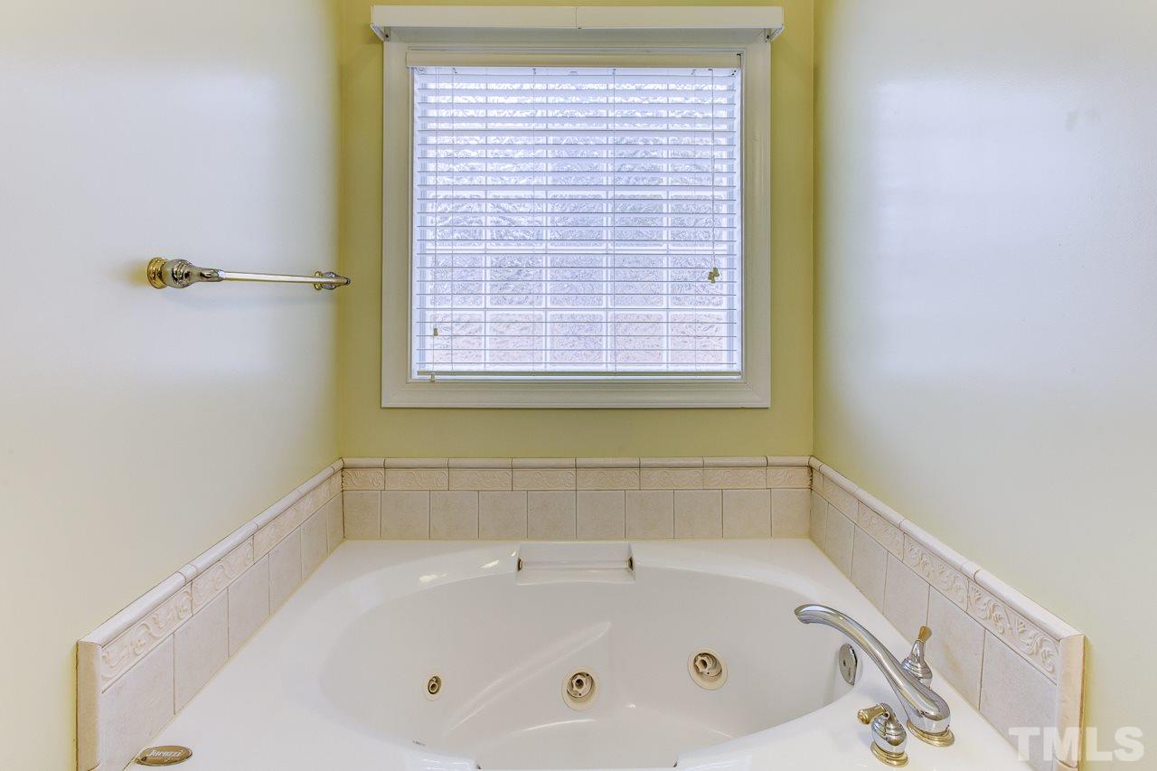 1432 Turner Farms Road Garner, NC 27529 - Photo 16 of 25 a bathroom with a bathtub