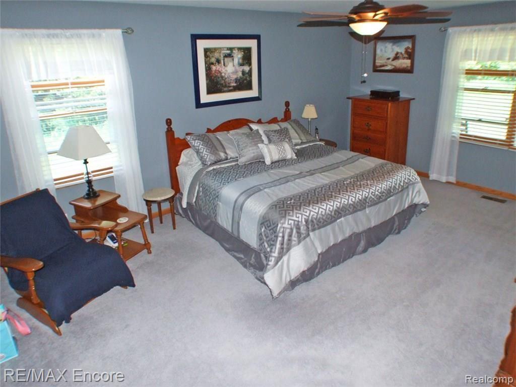 8945 Michigamme Road Clarkston, MI 48348 - Photo 15 of 30 Master bedroom with lots of natural light and ceiling fan