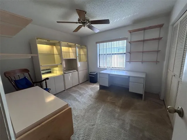 a living room with furniture and windows