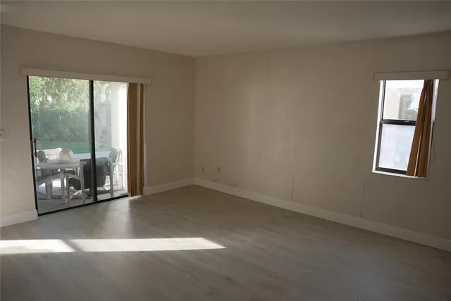 a view of an empty room with a window
