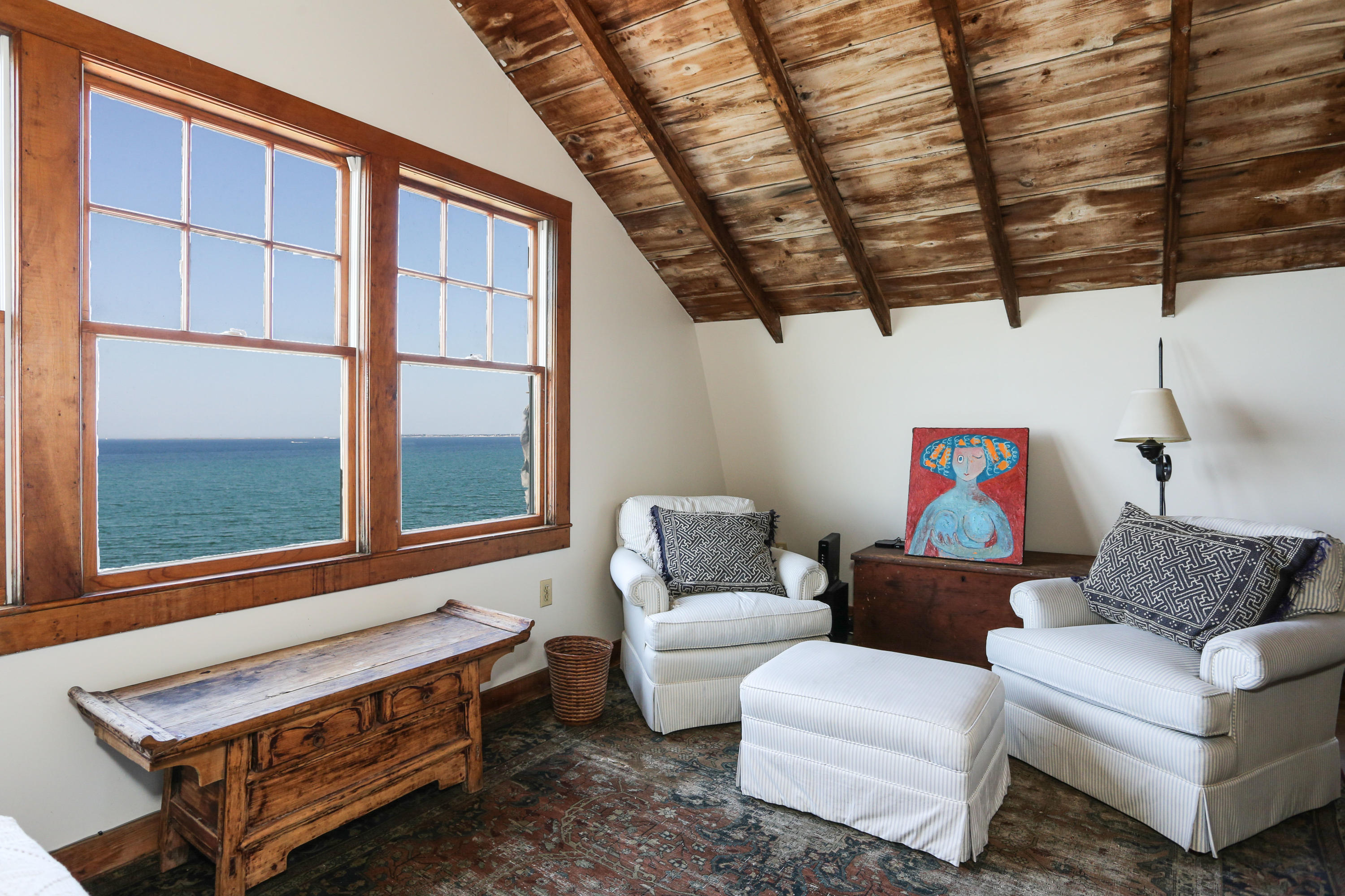 12 Pilgrims Path Truro, MA 02666 - Photo 15 of 25 a living room with furniture a ceiling fan and a window