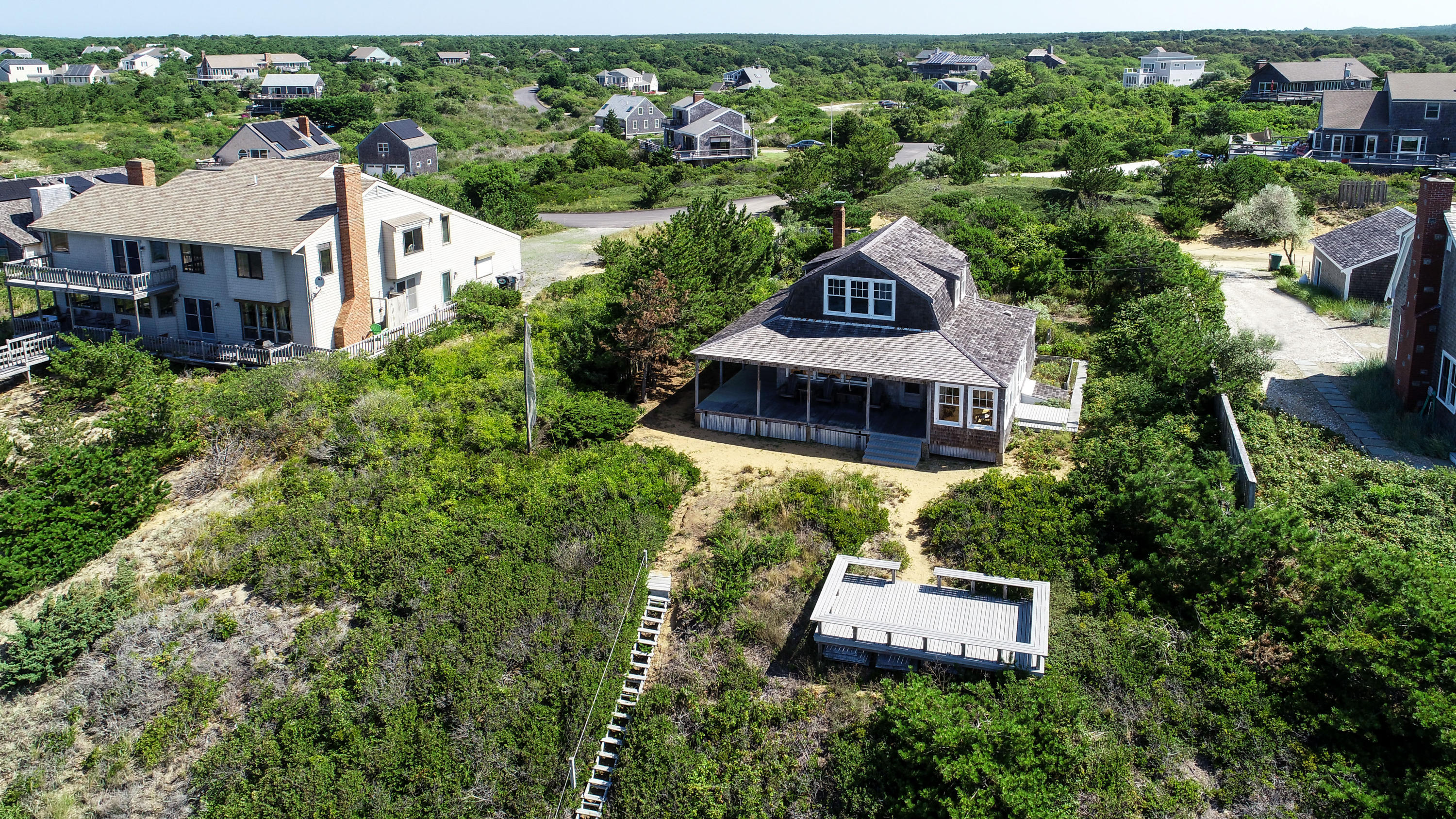 12 Pilgrims Path Truro, MA 02666 - Photo 3 of 25 an aerial view of a house with a garden