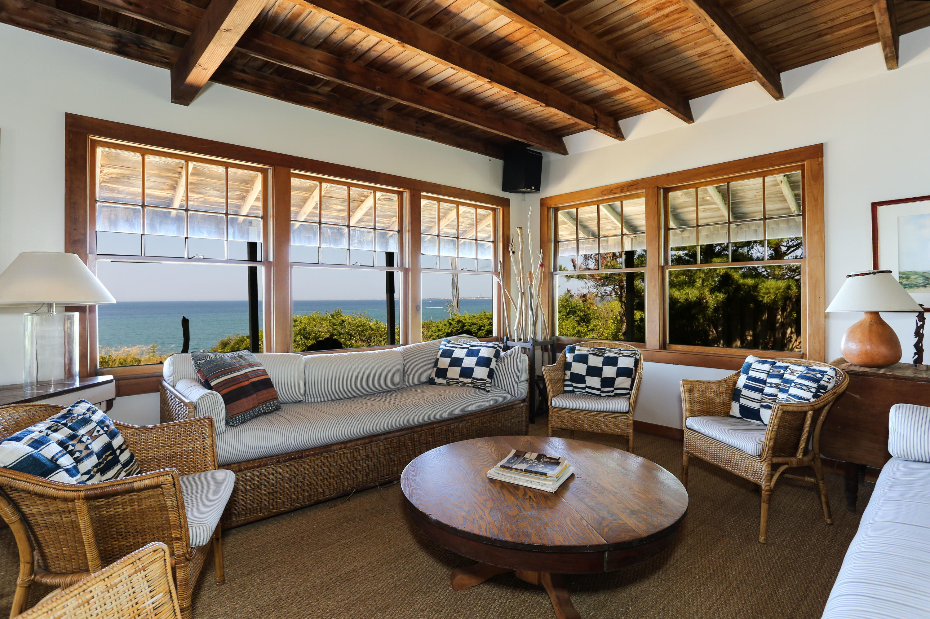12 Pilgrims Path Truro, MA 02666 - Photo 8 of 25 a living room with furniture and a large window