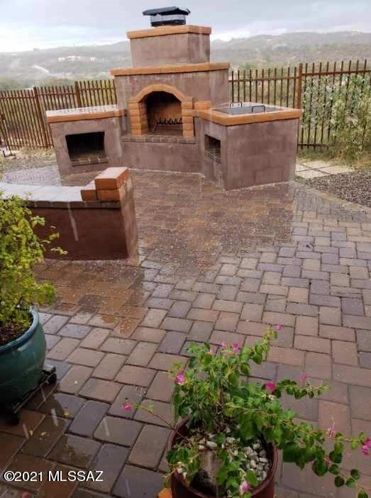1038 Oso Court Rio Rico, AZ 85648 - Photo 43 of 50 a view of a terrace with chairs and potted plants