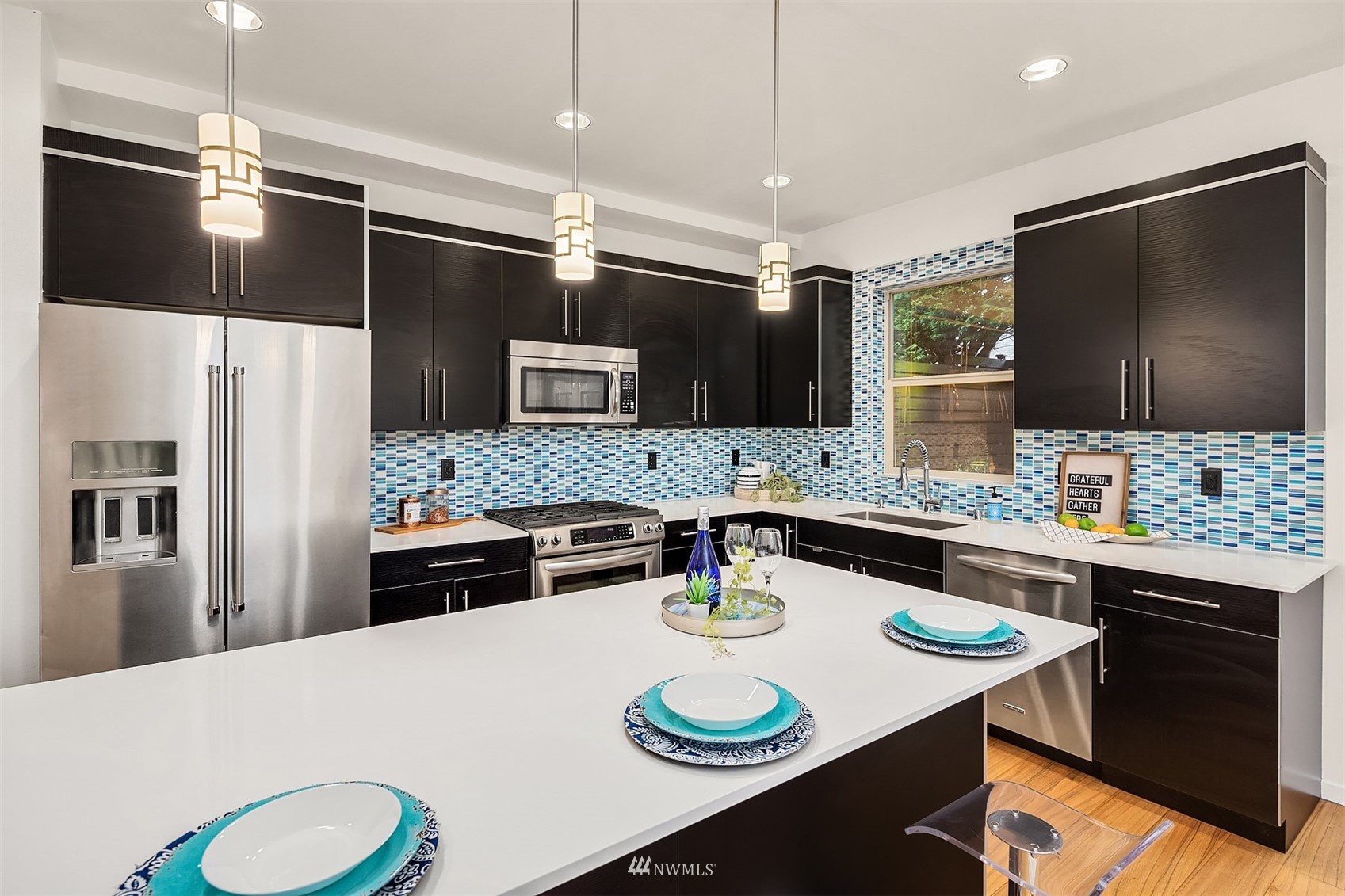 8000 Meridian Avenue North Seattle, WA 98103 - Photo 13 of 33 a kitchen with a refrigerator a stove a sink and chairs