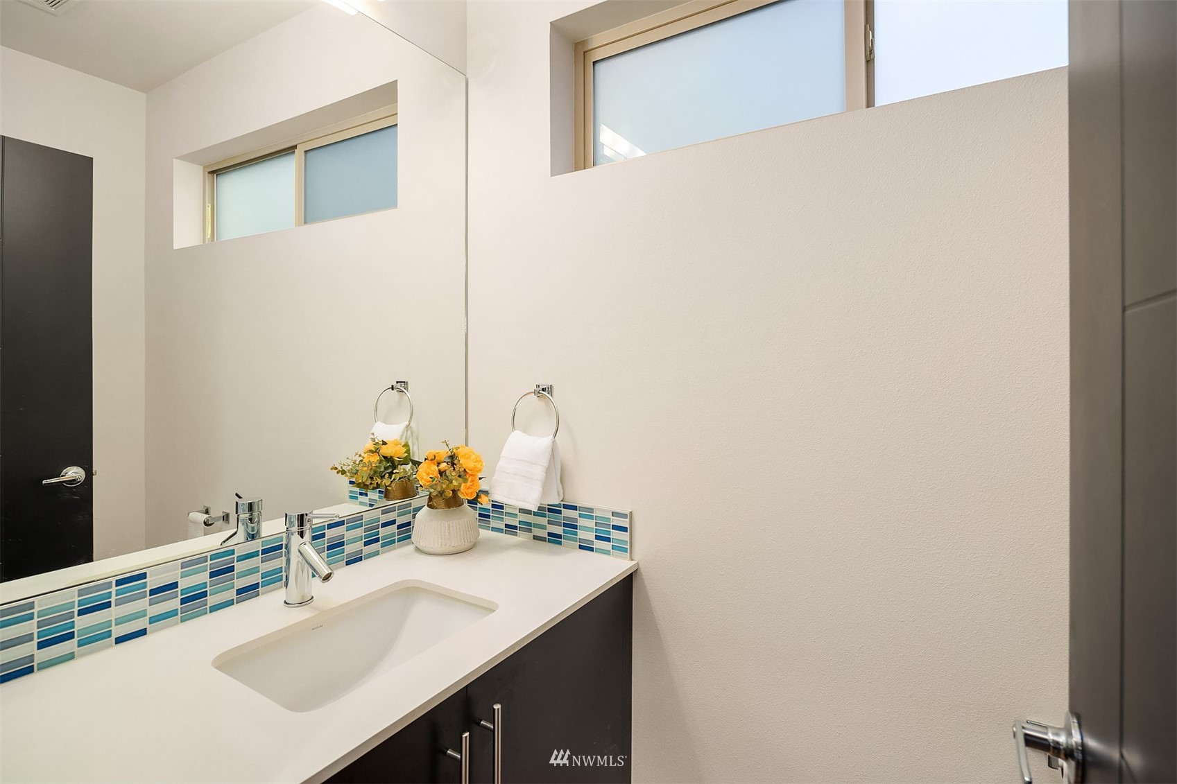 8000 Meridian Avenue North Seattle, WA 98103 - Photo 14 of 33 a bathroom with a sink and a mirror