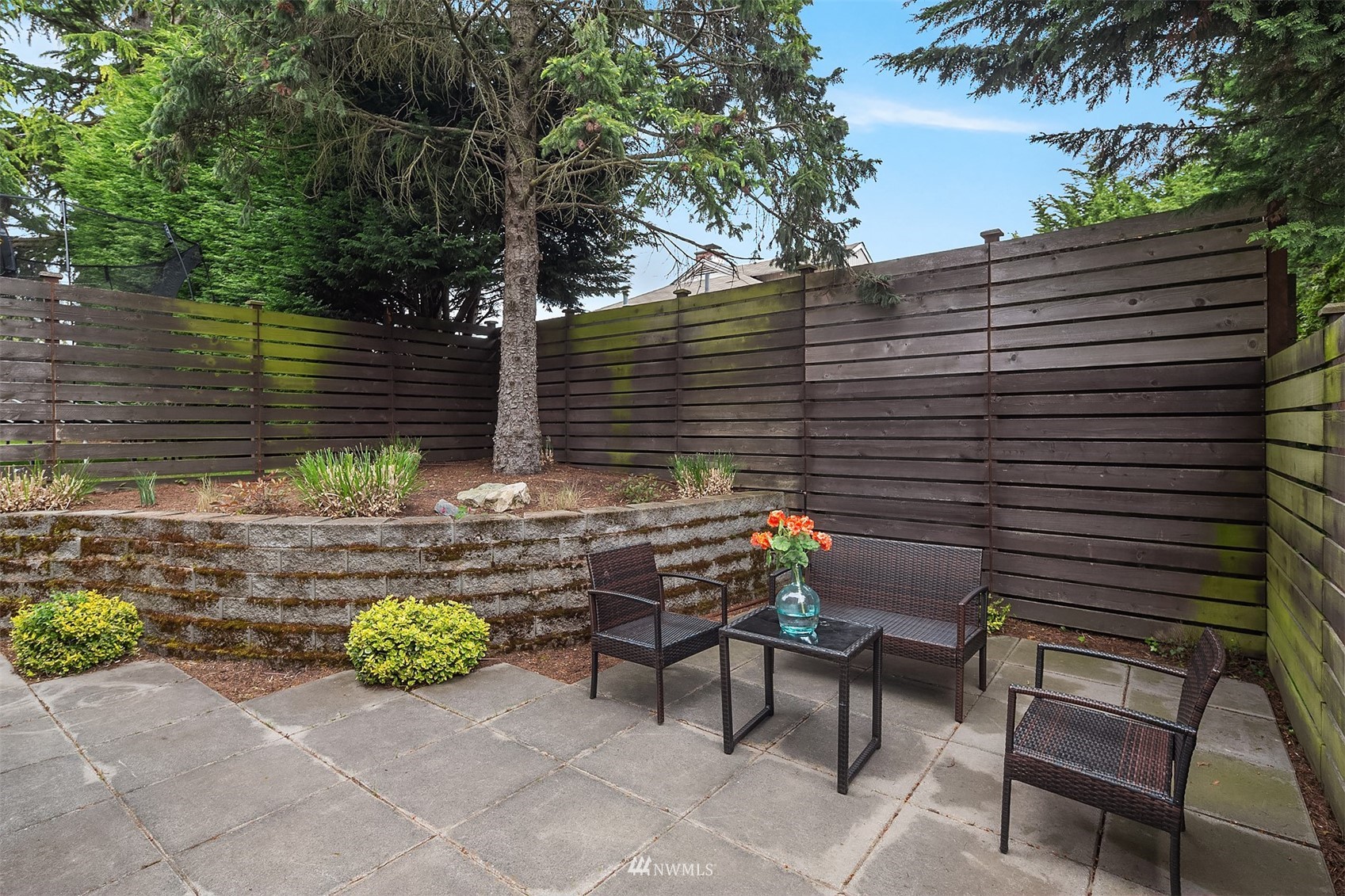 8000 Meridian Avenue North Seattle, WA 98103 - Photo 26 of 33 a view of a chairs and table in the back yard