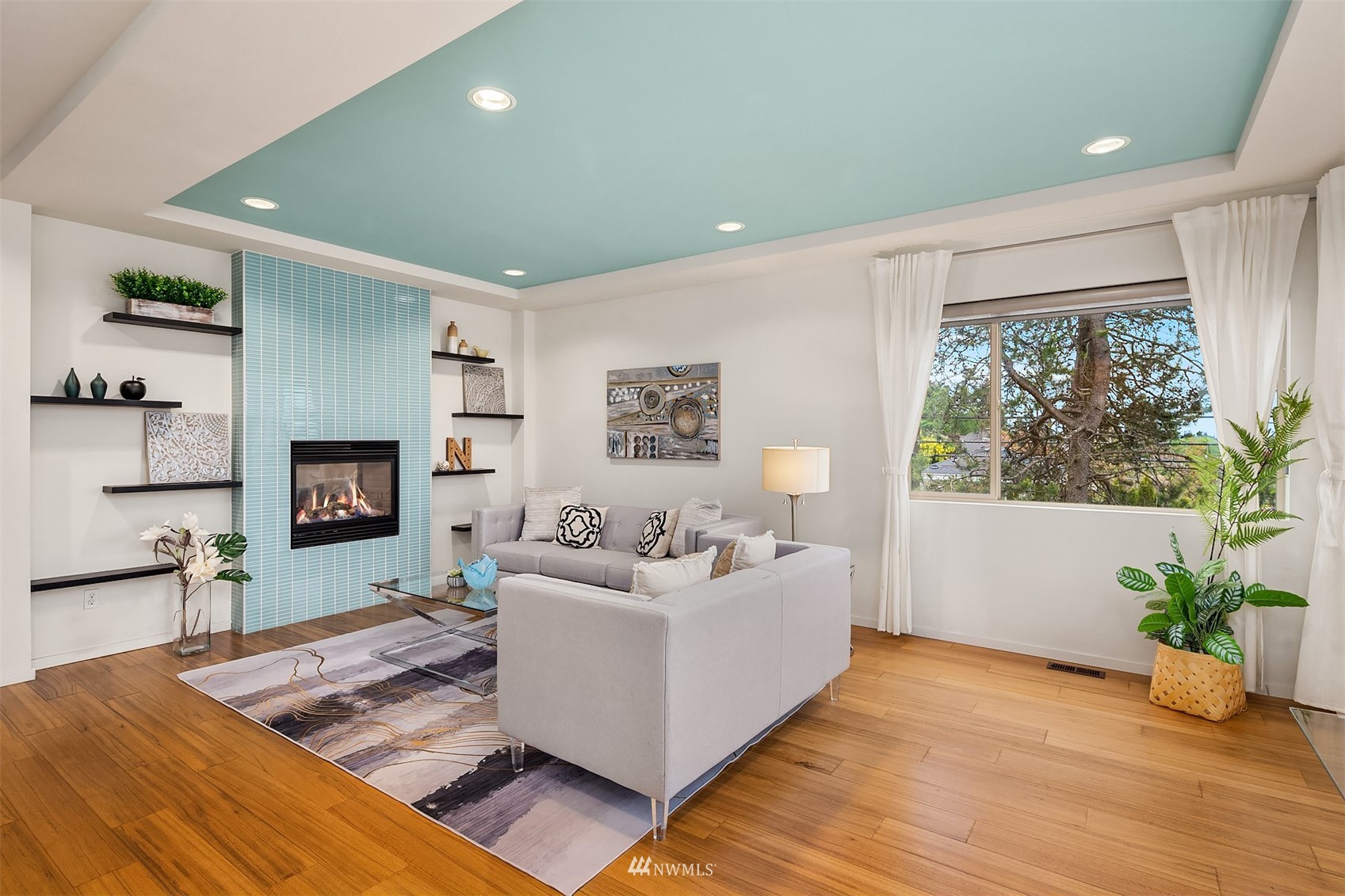 8000 Meridian Avenue North Seattle, WA 98103 - Photo 5 of 33 a living room with furniture and a fireplace