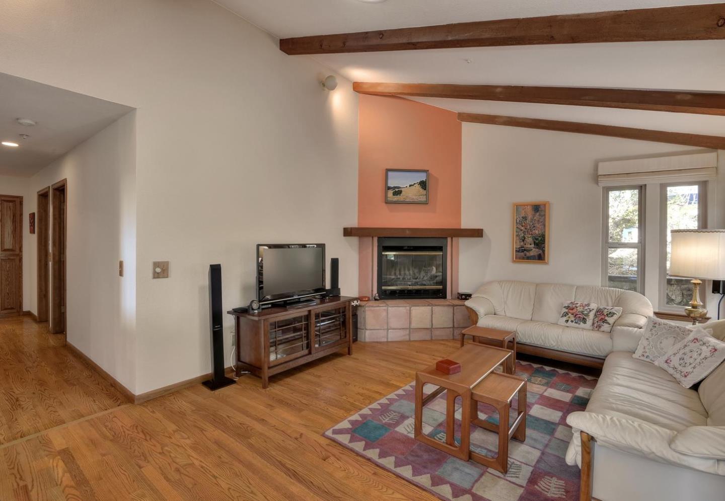 1737 Hecker Pass Road Gilroy, CA 95020 - Photo 11 of 27 a living room with furniture and a flat screen tv