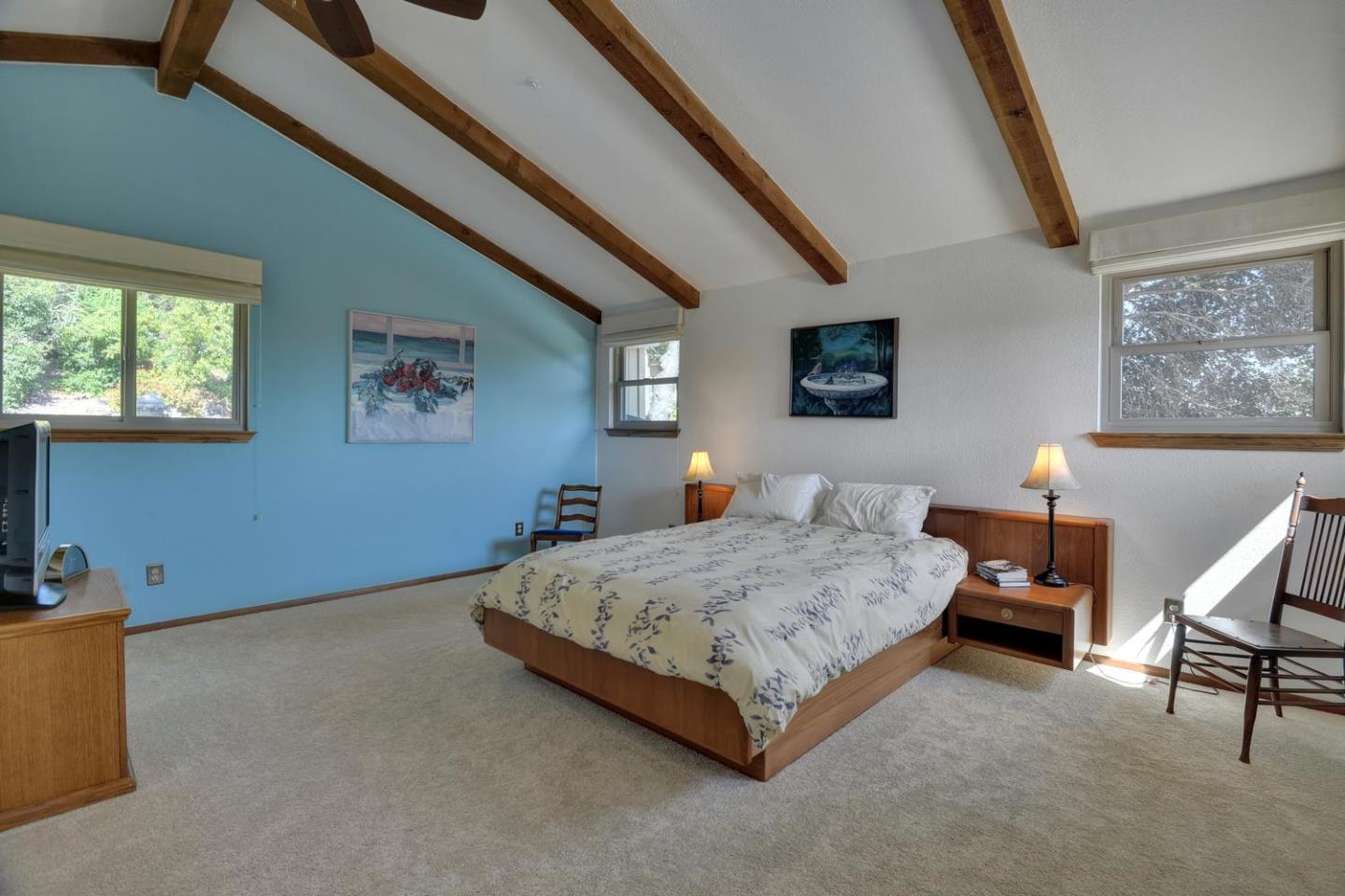 1737 Hecker Pass Road Gilroy, CA 95020 - Photo 13 of 27 a bedroom with a bed and chair