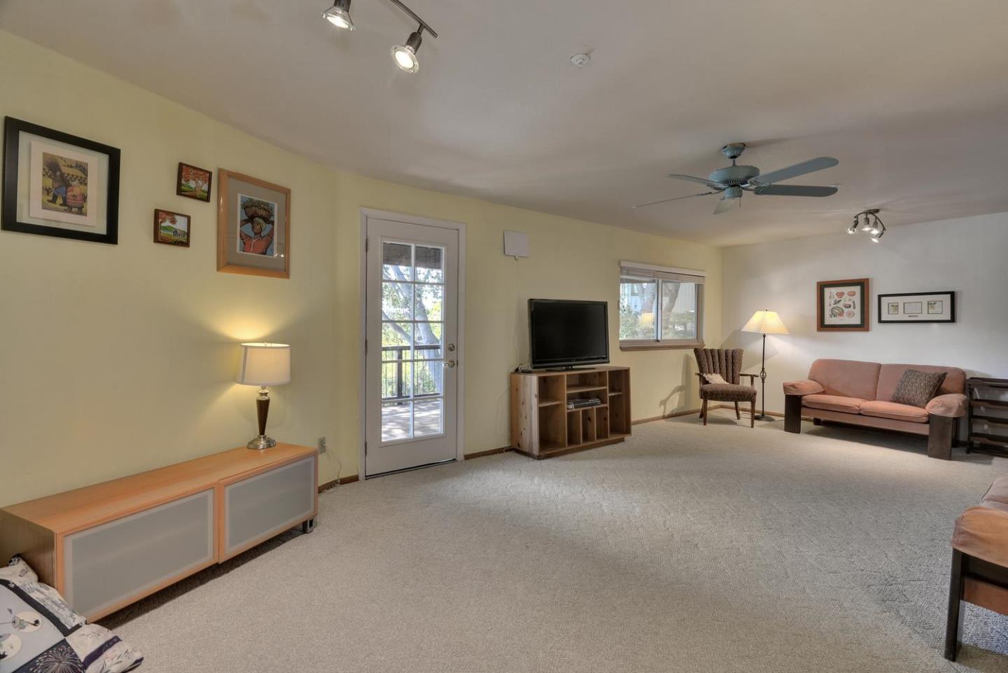 1737 Hecker Pass Road Gilroy, CA 95020 - Photo 16 of 27 a living room with furniture and a flat screen tv