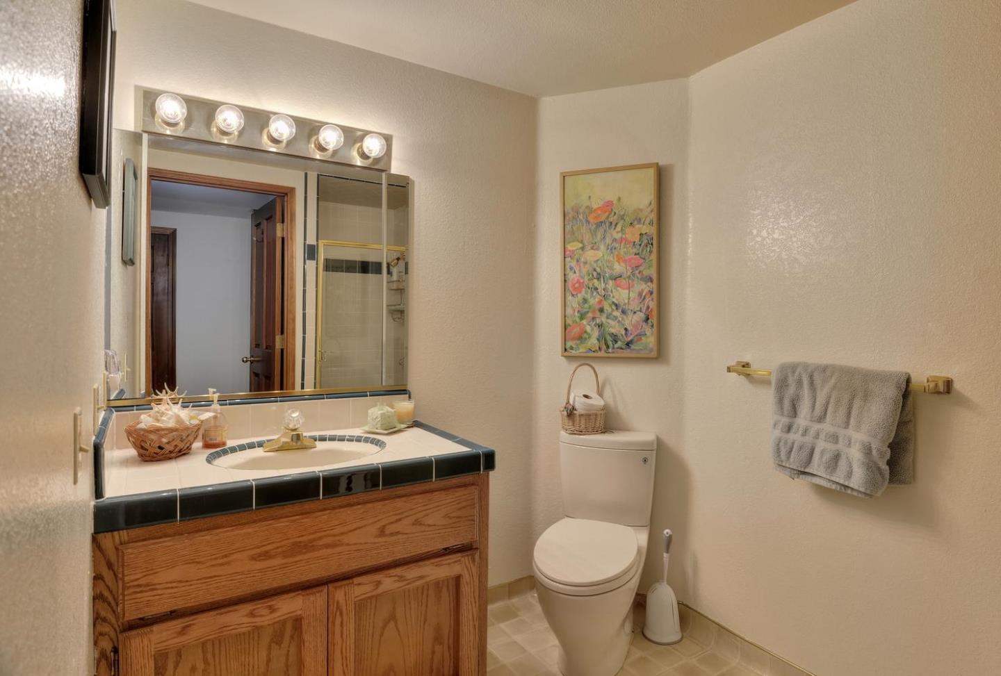 1737 Hecker Pass Road Gilroy, CA 95020 - Photo 18 of 27 a bathroom with a sink toilet and shower