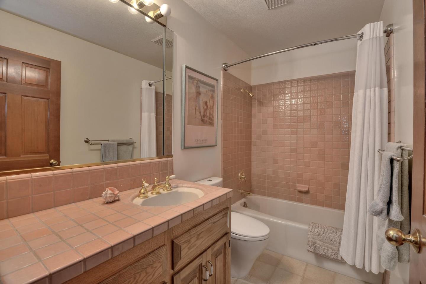 1737 Hecker Pass Road Gilroy, CA 95020 - Photo 22 of 27 a bathroom with a granite countertop sink toilet and shower