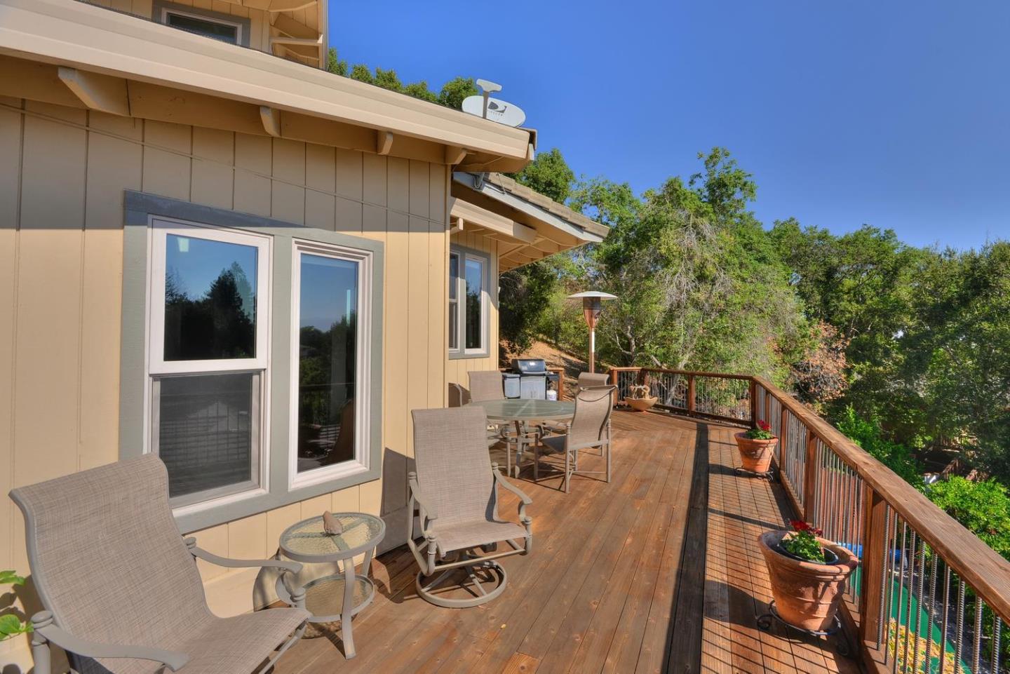 1737 Hecker Pass Road Gilroy, CA 95020 - Photo 25 of 27 a view of a patio with table and chairs with wooden floor and fence