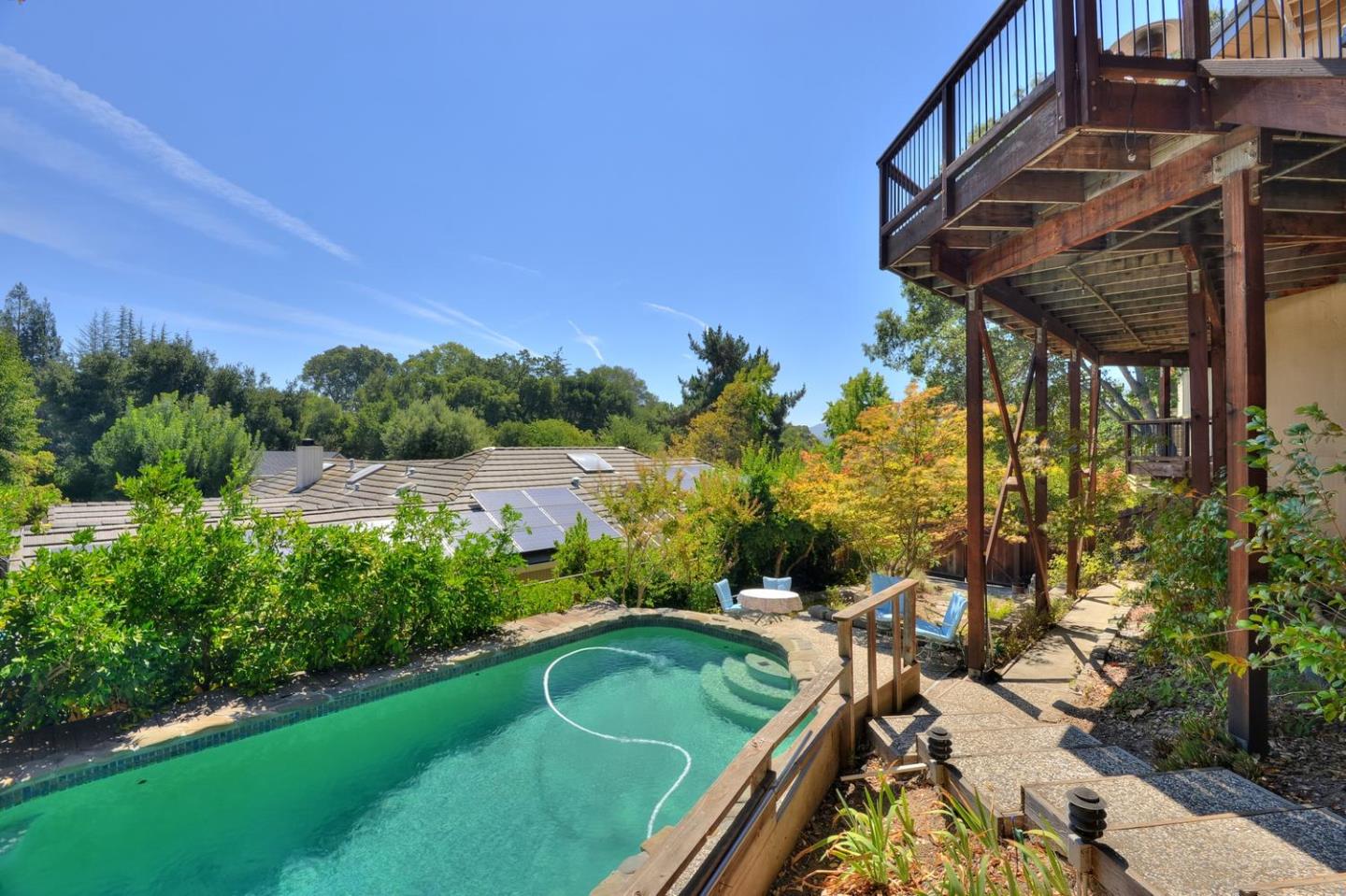 1737 Hecker Pass Road Gilroy, CA 95020 - Photo 27 of 27 a view of a backyard with plants and a patio