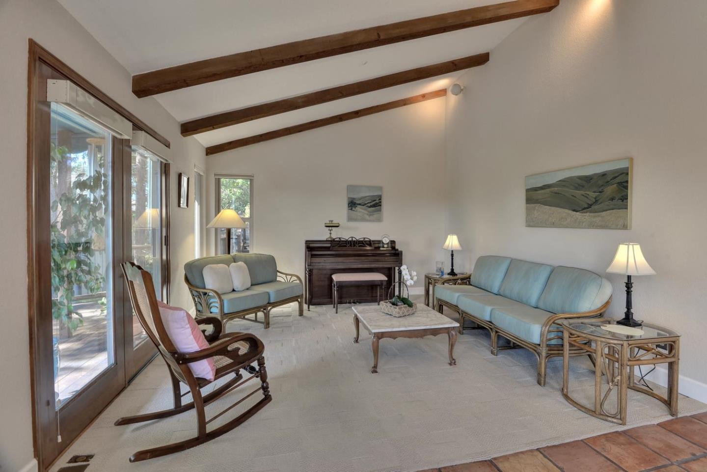 1737 Hecker Pass Road Gilroy, CA 95020 - Photo 4 of 27 a living room with furniture and a fireplace