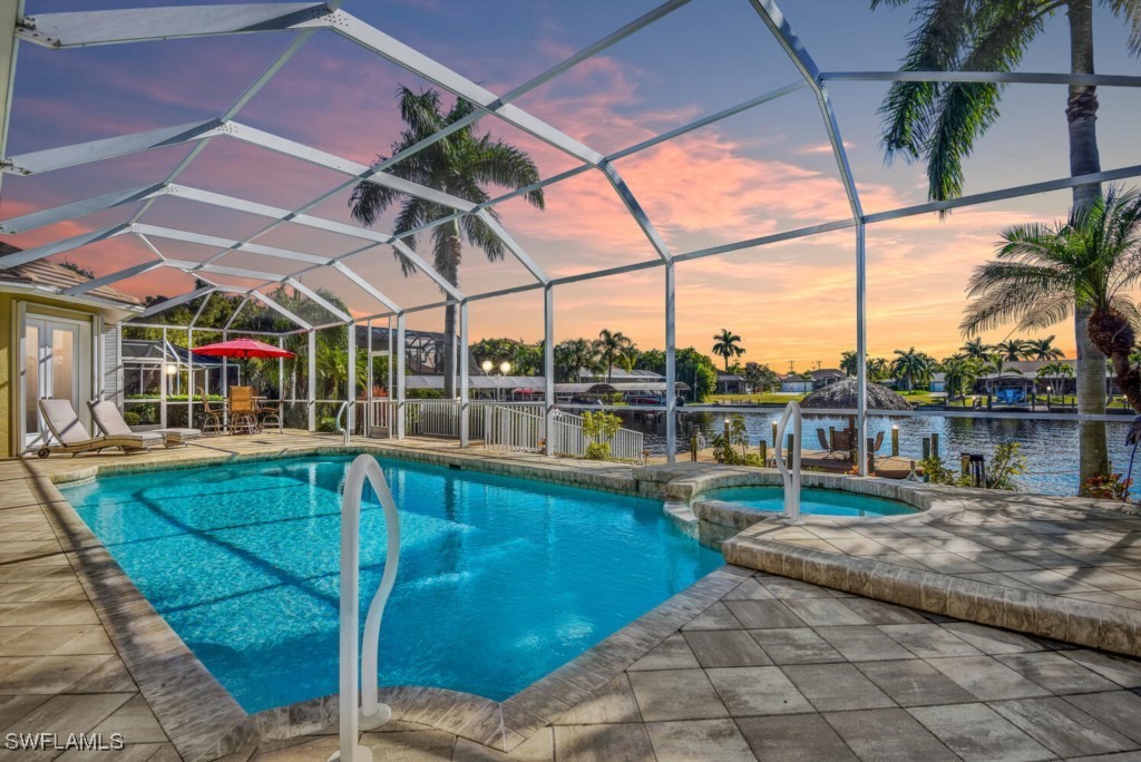 2810 Southwest 49th Terrace Cape Coral, FL 33914 - Photo 1 of 33 a view of a swimming pool with a patio