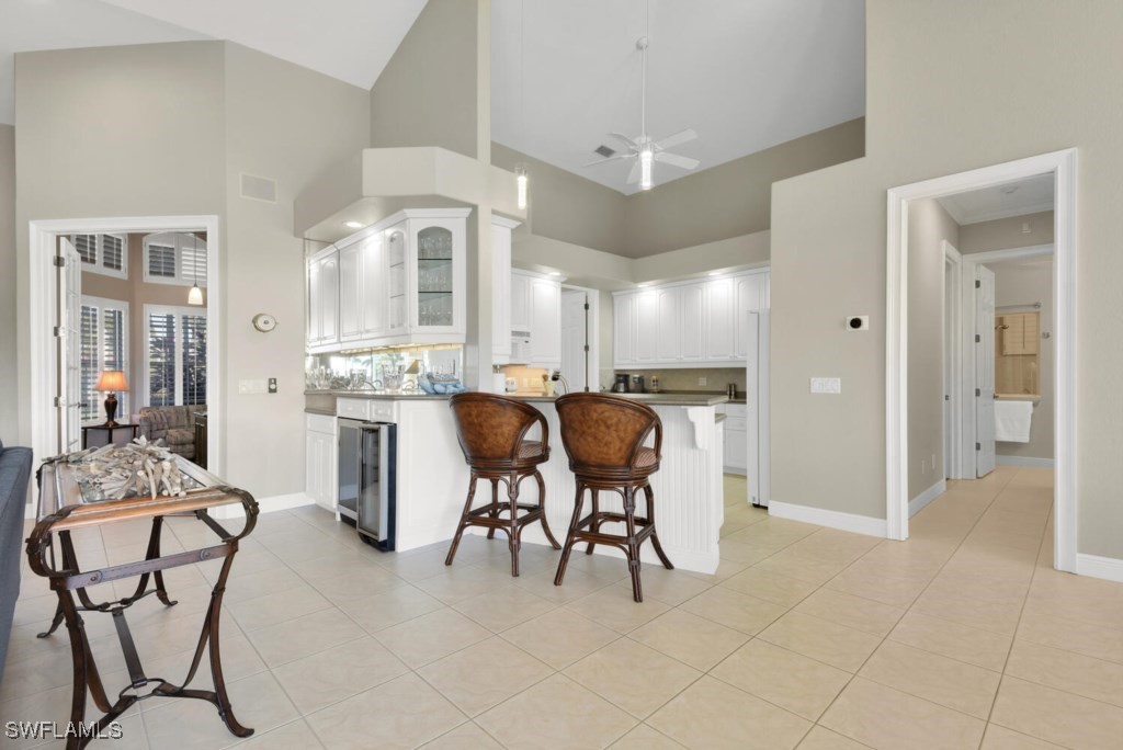 2810 Southwest 49th Terrace Cape Coral, FL 33914 - Photo 12 of 33 a living room with furniture a dining table and chairs