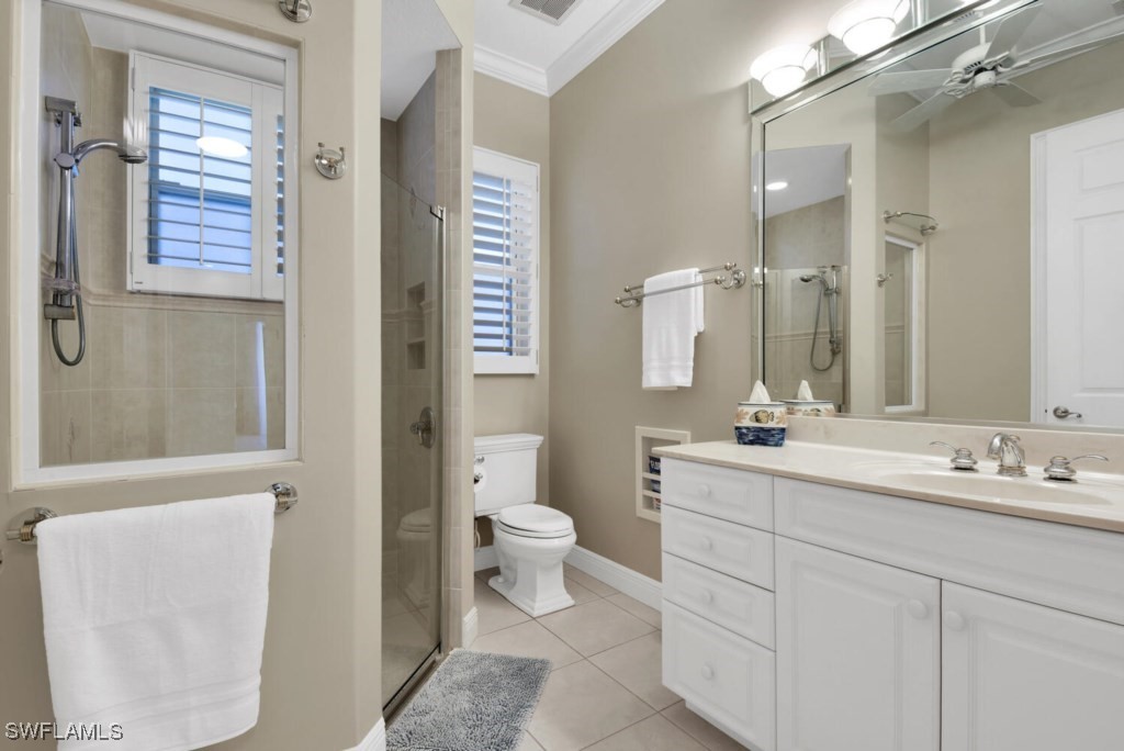 2810 Southwest 49th Terrace Cape Coral, FL 33914 - Photo 17 of 33 a bathroom with a double vanity sink toilet and shower