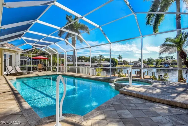 a view of a swimming pool with a lounge chairs