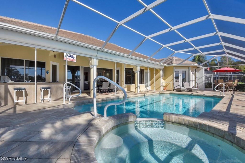 2810 Southwest 49th Terrace Cape Coral, FL 33914 - Photo 4 of 33 a view of a patio with table and chairs