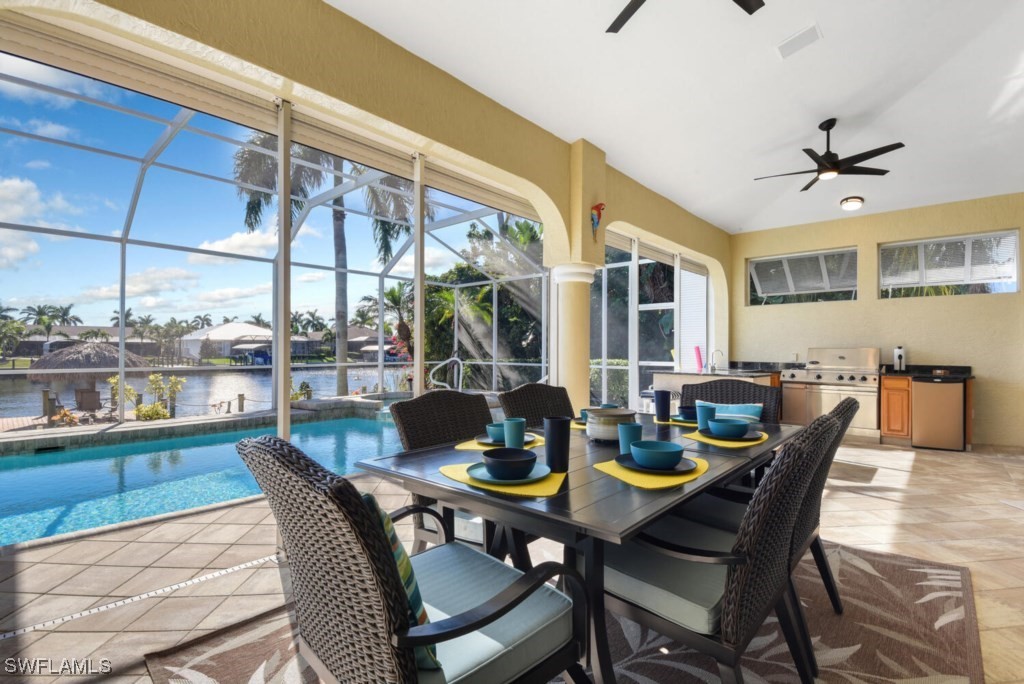 2810 Southwest 49th Terrace Cape Coral, FL 33914 - Photo 7 of 33 a view of a dining room with furniture window and wooden floor