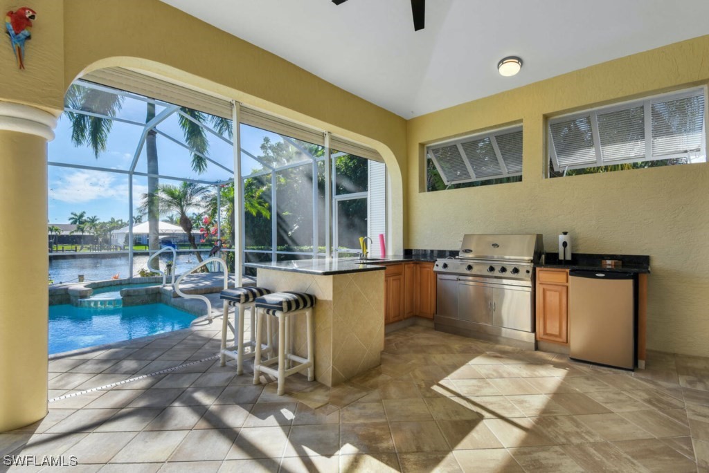 2810 Southwest 49th Terrace Cape Coral, FL 33914 - Photo 8 of 33 a kitchen with a sink and cabinets