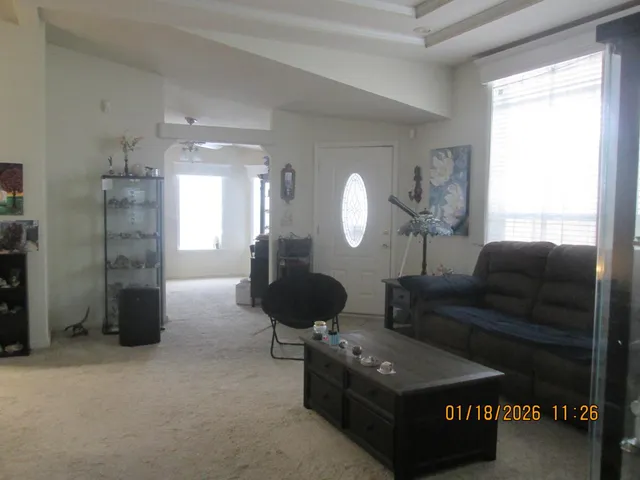 a living room with furniture and a window