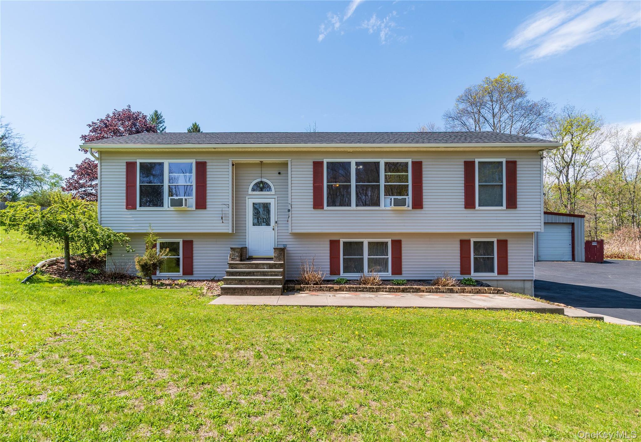 29 Murray Road Middletown, NY 10940 - Photo 2 of 24 a front view of a house with garden and plants
