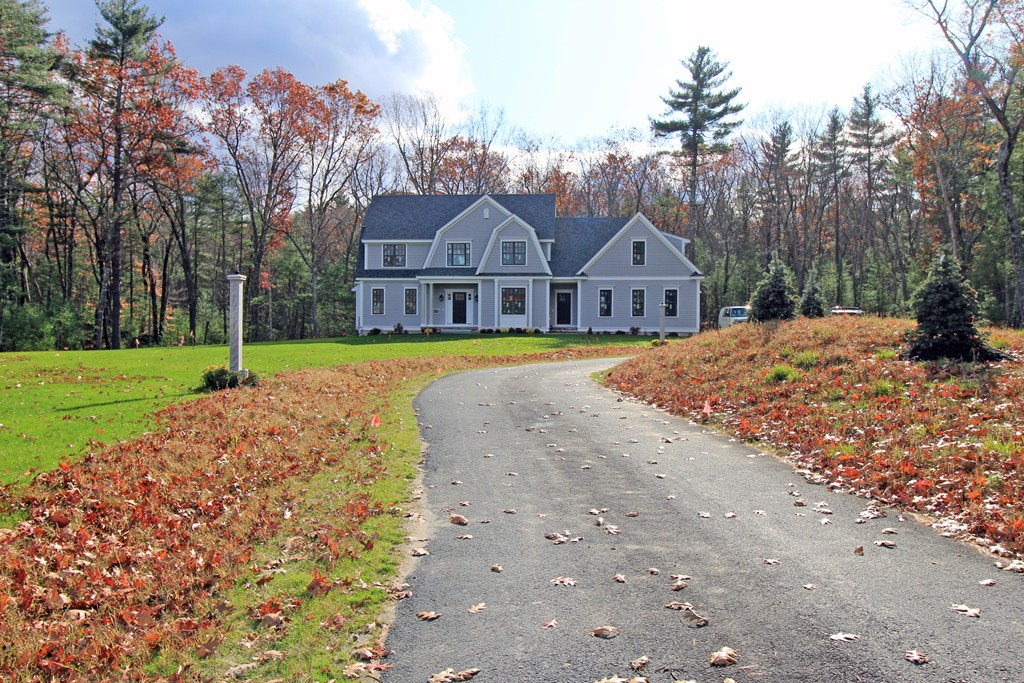 82 Chestnut Lane Carlisle, MA 01741 - Photo 1 of 1 a front view of a house with a yard