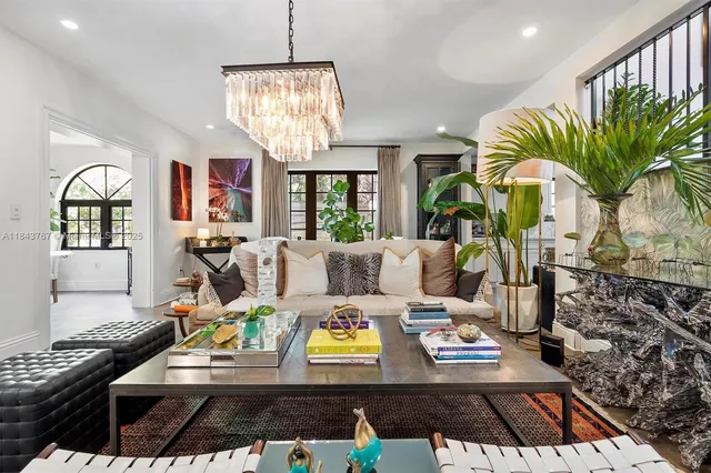a view of a dining room with furniture a potted plant and a potted plant