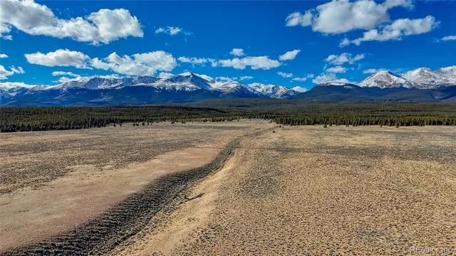 a view of an ocean and a mountain