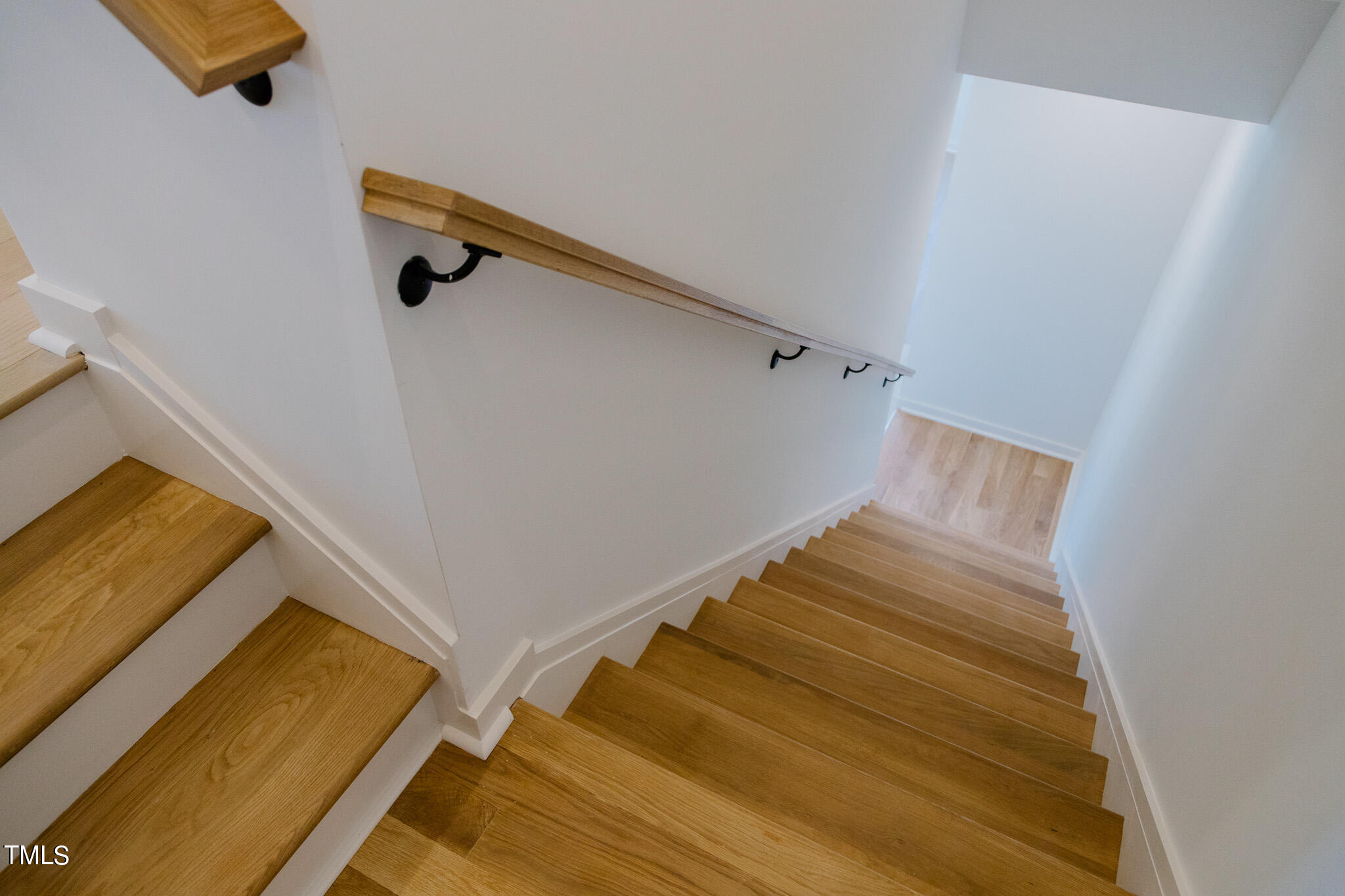 6425 Tanner Oak Lane Raleigh, NC 27613 - Photo 12 of 41 a view of a room with wooden floor