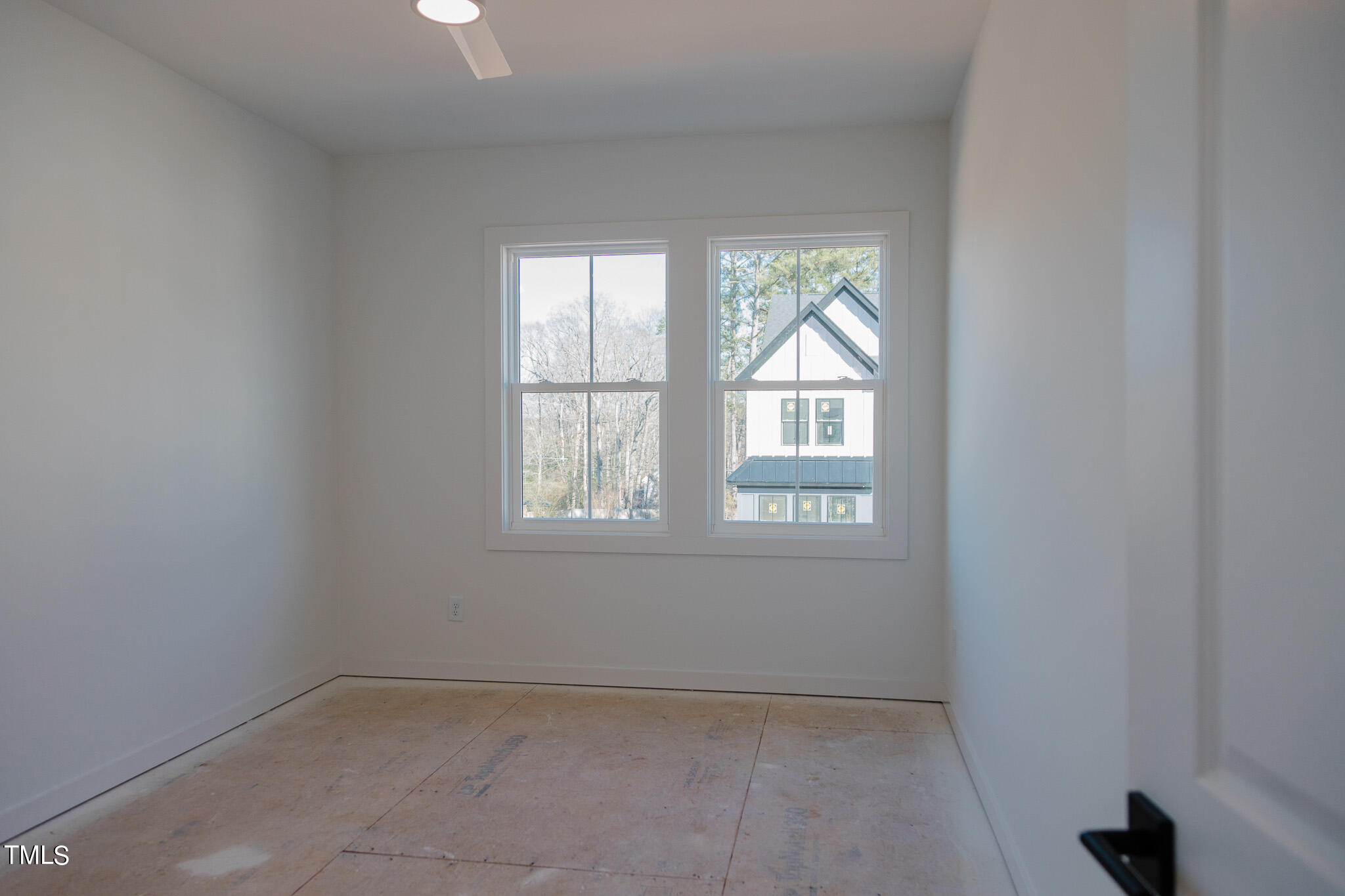 6425 Tanner Oak Lane Raleigh, NC 27613 - Photo 15 of 41 an empty room with a window