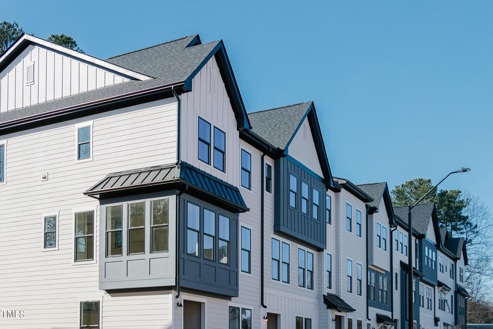 6425 Tanner Oak Lane Raleigh, NC 27613 - Photo 3 of 41 a view of an house with roof deck