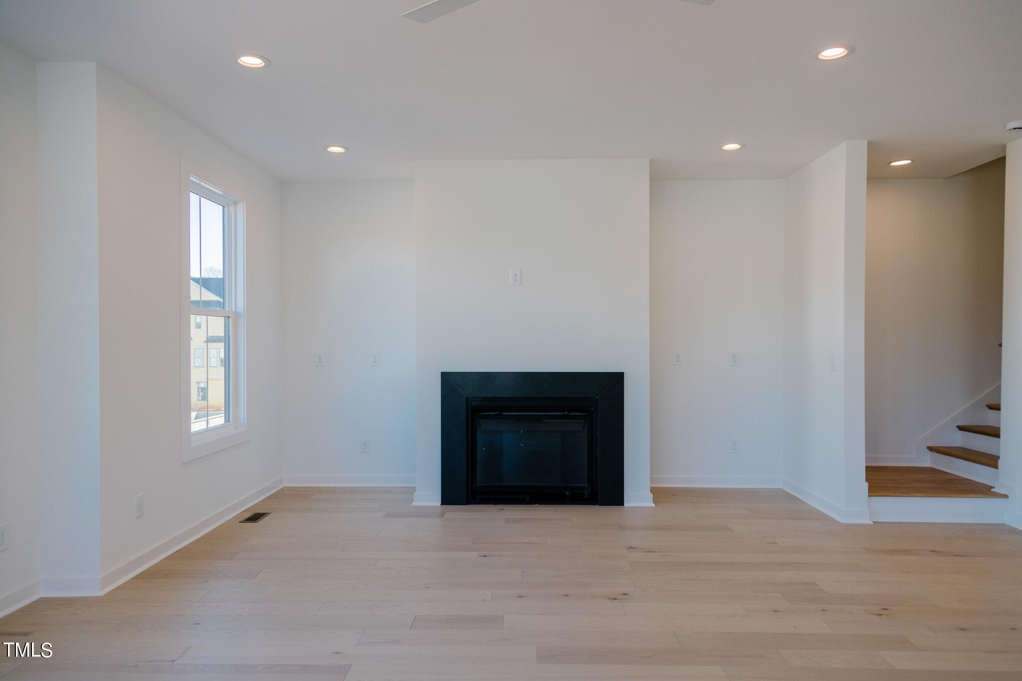 6425 Tanner Oak Lane Raleigh, NC 27613 - Photo 7 of 41 a view of an empty room with a closet and a window