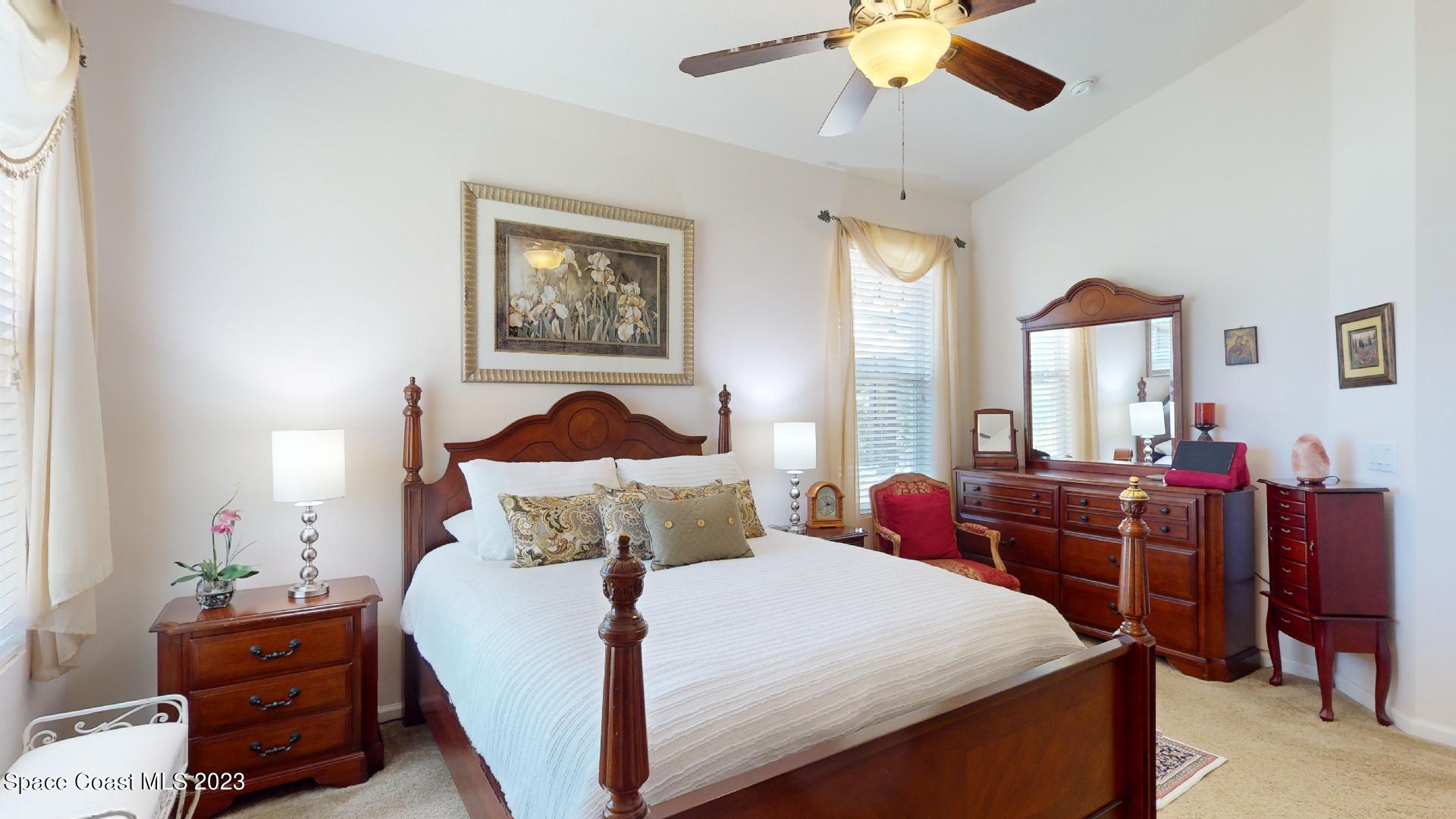 3242 Arden Circle Melbourne, FL 32934 - Photo 17 of 28 a bedroom with bed and window